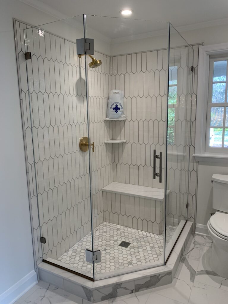 Photo of Swing Neo Standard Door Hinged on Glass in Neo Angle Layout with Brushed Nickel Hardware Finish